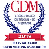 A red and blue ribbon with the words " texas mediator credentialing association " on it.