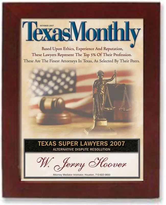 A plaque with the texas monthly logo and a statue of justice.