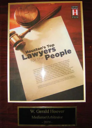 A plaque with the words " houston 's top lawyers for people ".